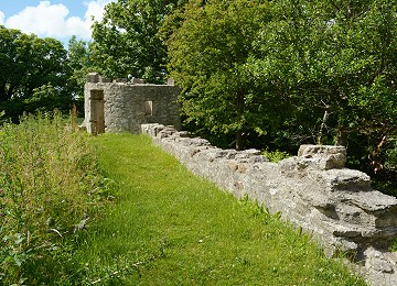 Aberlleiniog walls and tower amongst trees