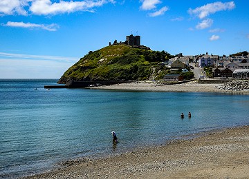 Criccieth castle towers over the beach