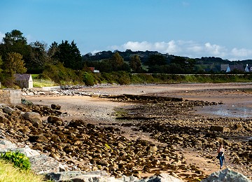 Looking down Lleiniog beach at low water from the car park