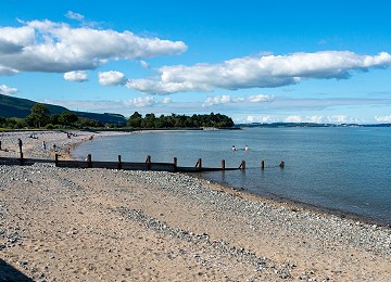 People enjoy the sea at Llanfairfechan Beach