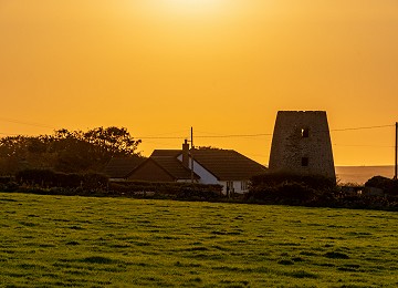 Melin Hermon as the sun sets over Anglesey