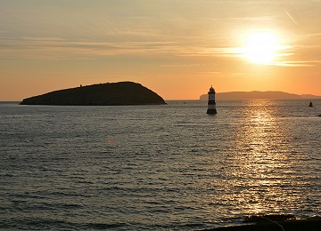 Puffin Island and Trwyn Du lighthouse sunrise