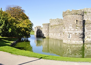 The walls and moat at Beaumaris Castle in Autumn