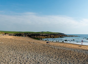 Porth Tyn Tywyn beach looking towards Barclodiad y Gawres burial chamber
